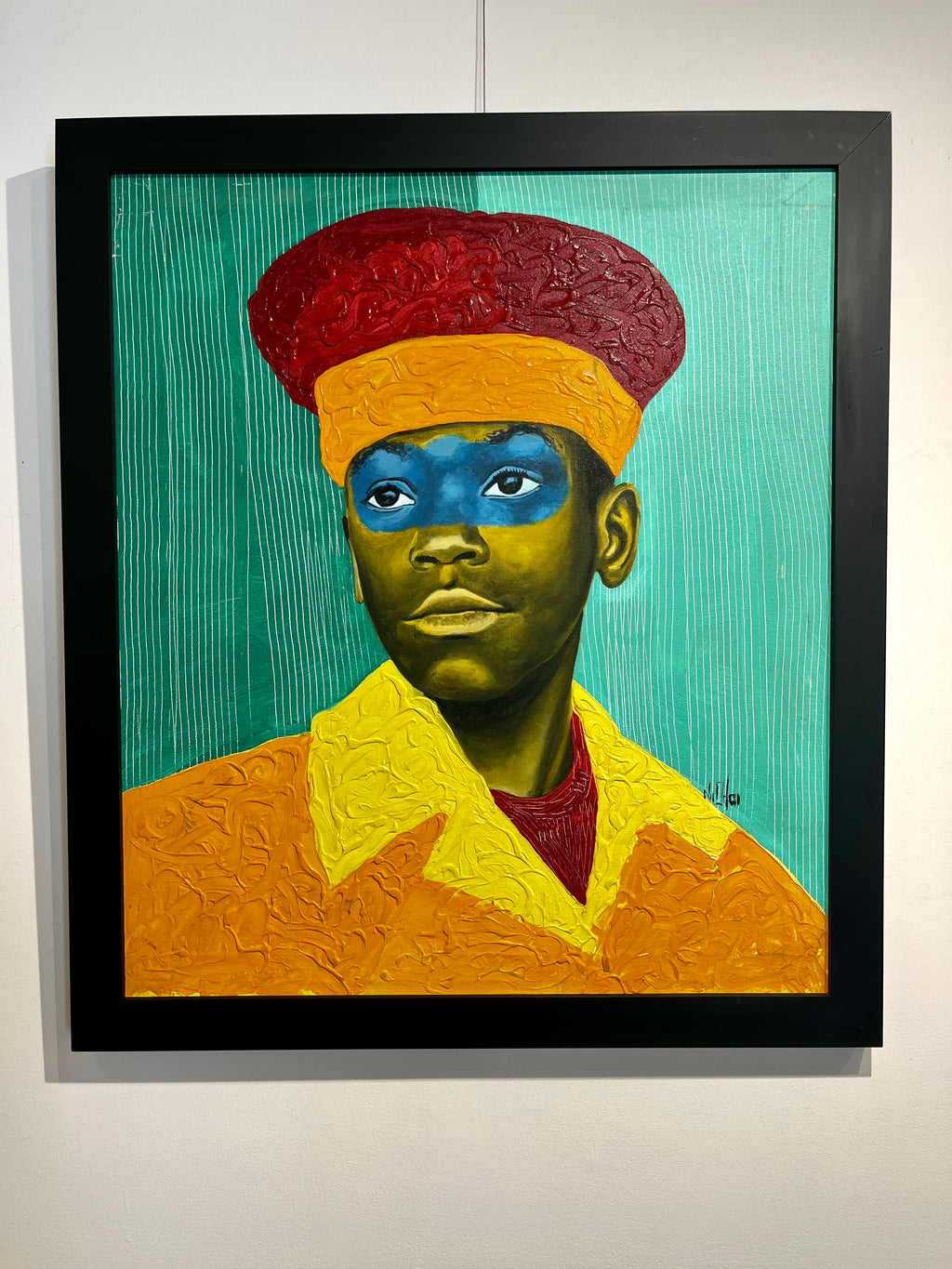 acrylic painting of an African boy with red and orange hat and green background